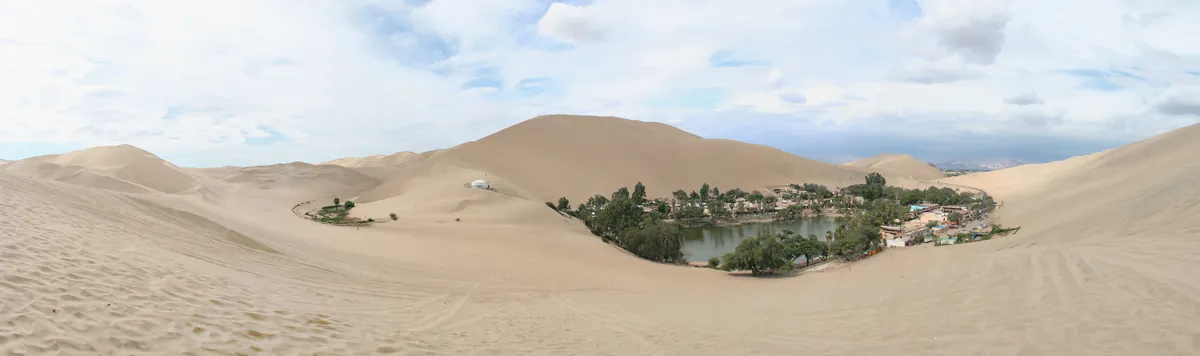 Dune buggy and sandboarding on the dunes above Huacachina, Peru
